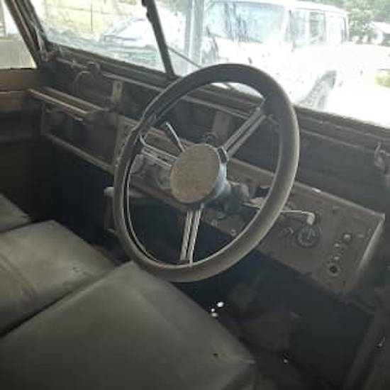 The drivers side interior of a 1960 Series 2 Land Rover barn find that has been sitting in a field for 15 years